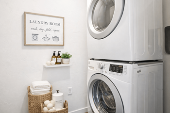 Laundry room with stacked washer and dryer